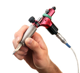 Red tattoo machine in hand isolated on white background