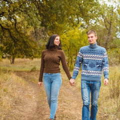 couple walking in the park outdoors