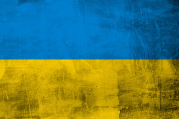 Grunge flag of Ukraine on concrete wall - obrazy, fototapety, plakaty