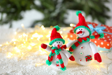 Cute snowmen on Christmas background