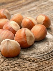 Hazelnuts on wooden background