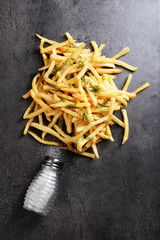 french fries with salt and dill on table