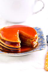 Pile of pancakes with syrup