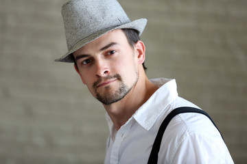 Close up portrait of handsome musician man in hat