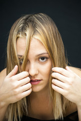 Portrait of Beautiful Young Woman  with her hair over her face