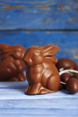 Easter chocolate bunnies and eggs on wooden background