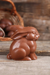 Easter chocolate bunny and eggs on wooden background