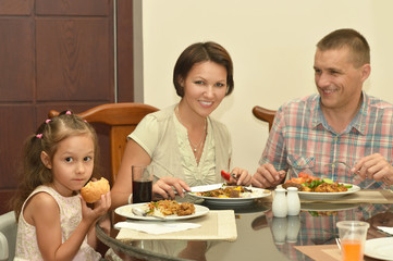 Obraz na płótnie Canvas Happy family at breakfast