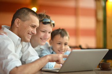 Family sitting with laptop