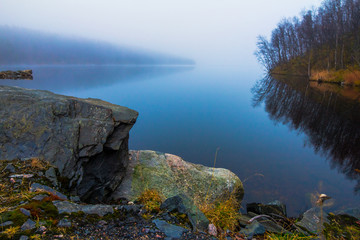 Mist over the lake in the early morning in autumn
