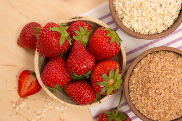 Oatmeal and strawberries on the table