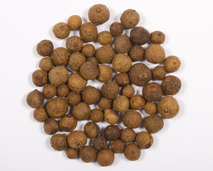 Grains of allspice isolated on white
