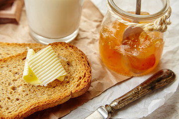 Closeup breakfast with toast, roasted pan with butter and aprico