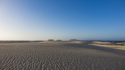 Bright sun on patterned sand in Corralejo, Fuerteventura, Canary