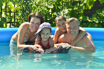 Family relax in  pool