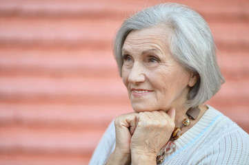 Mature woman near wall