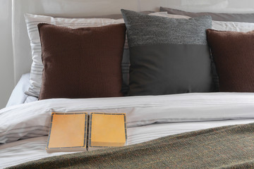 Book on the bed with classic color pillows