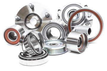 located on a white background variety of bearings and rollers wide range of applications, from automotive hub to engine belt tensioners