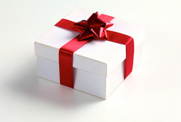 New Year gift on a golden tinsel background boly