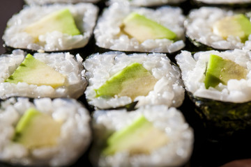 Avocado maki sushi close-up,very shallow depth of the field