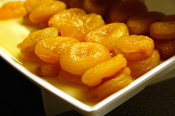 Dried apricots on the plate, close-up