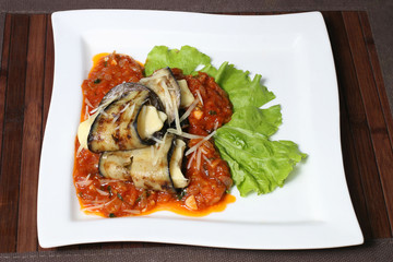 baked eggplant with cheese and vegetable sauce