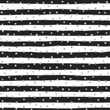Seamless pattern of random silver dots.