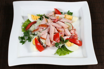 salad of ham and eggs with vegetables