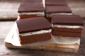 Delicious chocolate brownies on wooden background