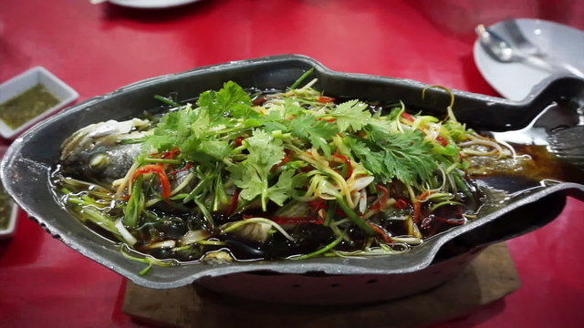 Video of Chinese food style whole fish steam with soy sauce and spring onion