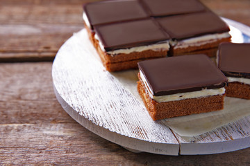 Delicious chocolate brownies on wooden background