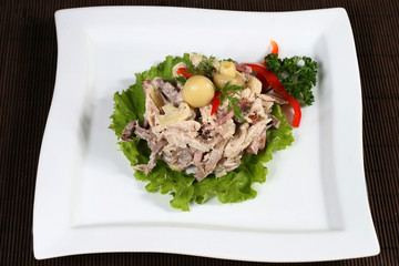 meat salad with mushrooms and greens