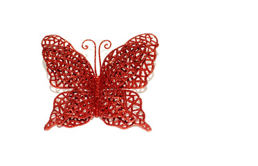 Butterfly on a white background. Christmas toy butterfly with glitter. 