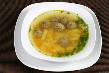soup with meatballs and greens