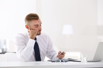 Businessman working with laptop in office