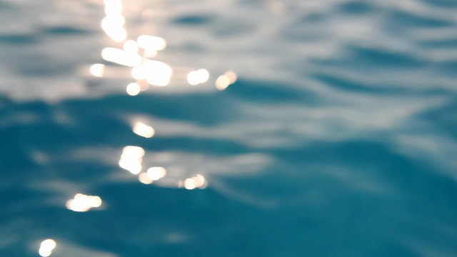 Beautiful sea in sunlight, soft focus, sun rays playing on water waves, summer vacation concept. Full HD Video 1920x1080 
