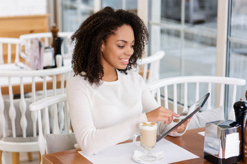 Restaurant customer using portable tablet.