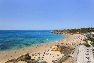 People enjoying the beach of Oura, Albufeira, Algarve