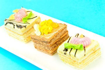 Sweets: Cream Cakes on Plate.