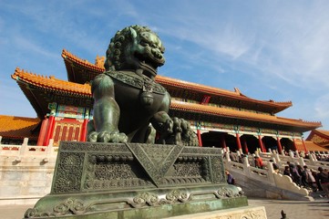 lion statue in front of the palace