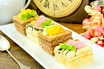 Sweets: Cream Cakes on Plate.