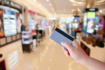 Female hand holding credit card