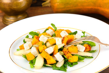 Healthy and Diet Food: Salad, Pumpkin, Pear, Cheese and Seeds.
