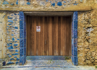 Ancient Garage door in Turkey, with a label written 