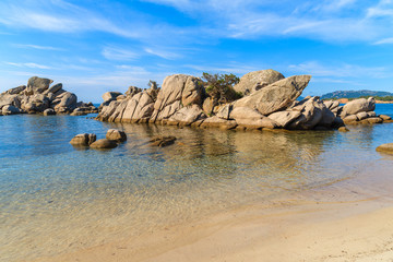 Fototapeta na wymiar Rocks in sea water on Palombaggia beach, Corsica island, France