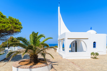 Fototapeta na wymiar Beautiful typical white Greek church near Potami bay, Samos island, Greece