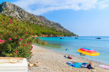 Sun umbrella on beautiful secluded beach on Samos island, Greece