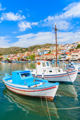 Naklejka na ściany i meble Traditional colourful Greek fishing boats in Pythagorion port, Samos island, Greece