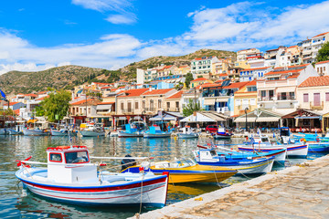 Traditional colourful Greek fishing boats in Pythagorion port, Samos island, Greece - obrazy, fototapety, plakaty