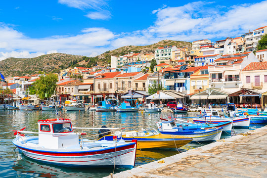 Traditional colourful Greek fishing boats in Pythagorion port, Samos island, Greece